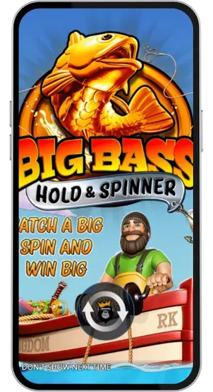 Big Bass Hold and Spinner loading screen showing the gold bass logo, the bearded fisherman character and the Reel Kingdom branding on a boat against a blue sky background